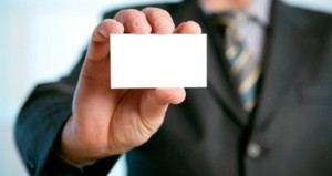 Man holding a printed business card