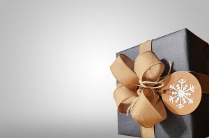 Christmas present wrapped in gift wrap and a ribbon